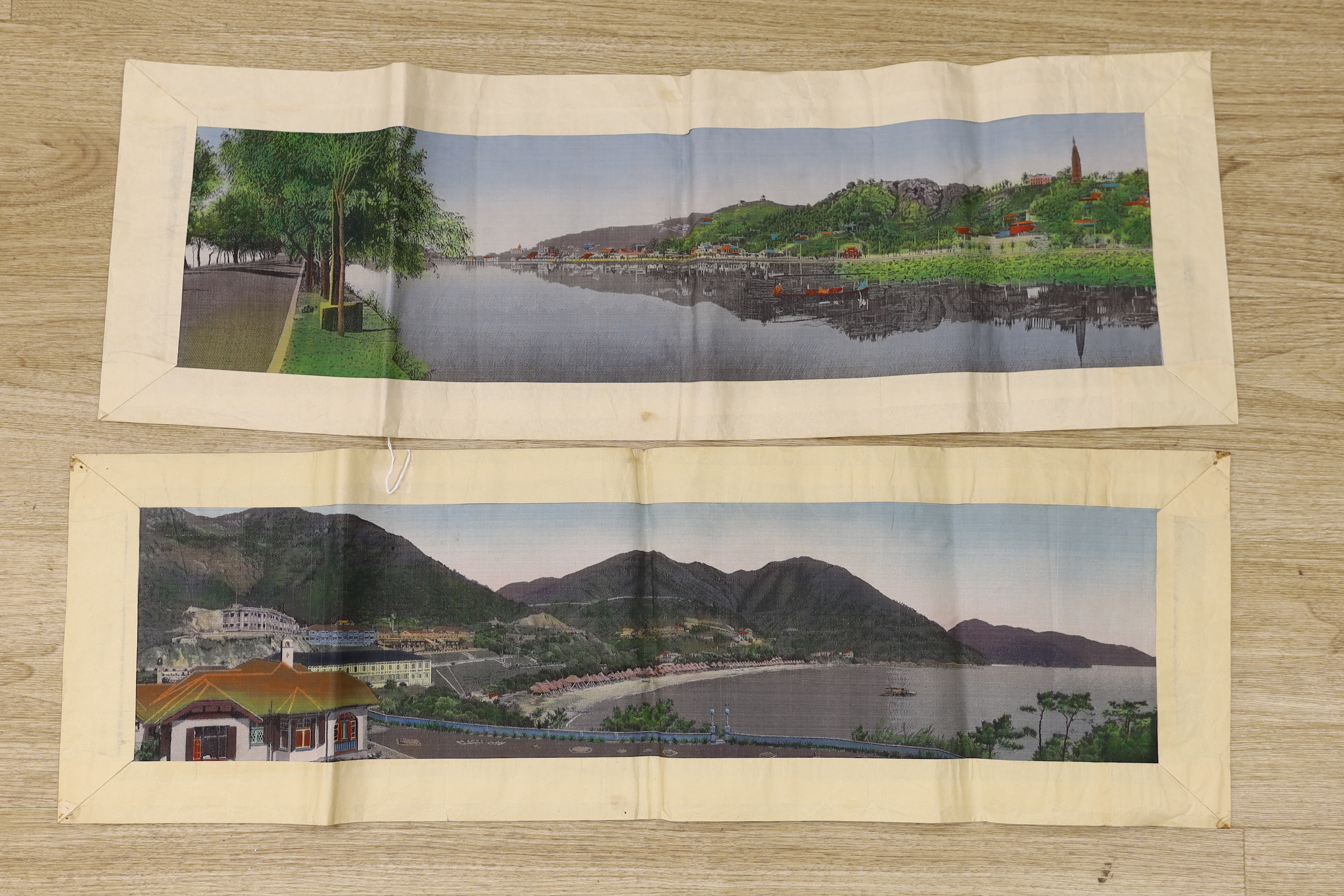 Two Chinese 1920’s machine silk panels, one depicting a contemporary Chinese coastline, the other a contemporary river scene, 71cm wide